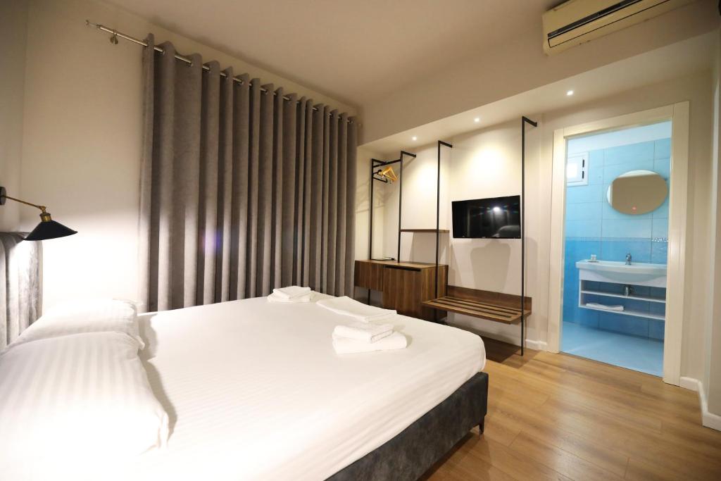Postel nebo postele na pokoji v ubytování HOTEL LIBERTAS