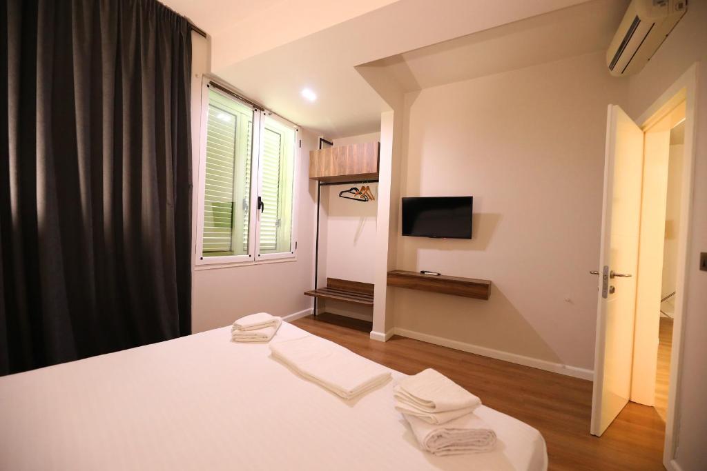 Postel nebo postele na pokoji v ubytování HOTEL LIBERTAS