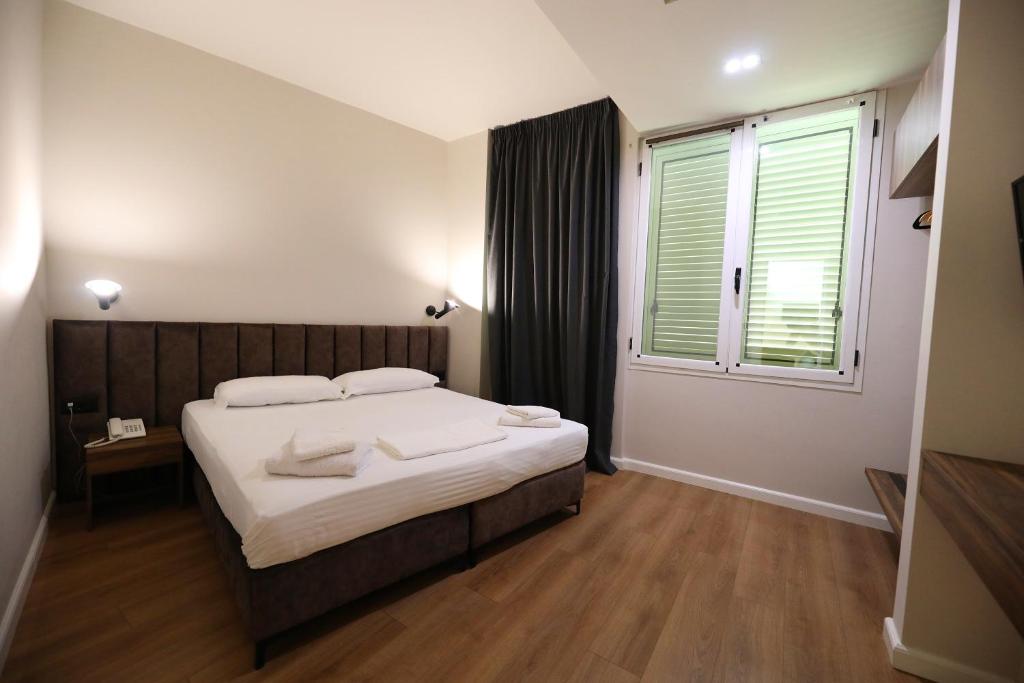 Postel nebo postele na pokoji v ubytování HOTEL LIBERTAS