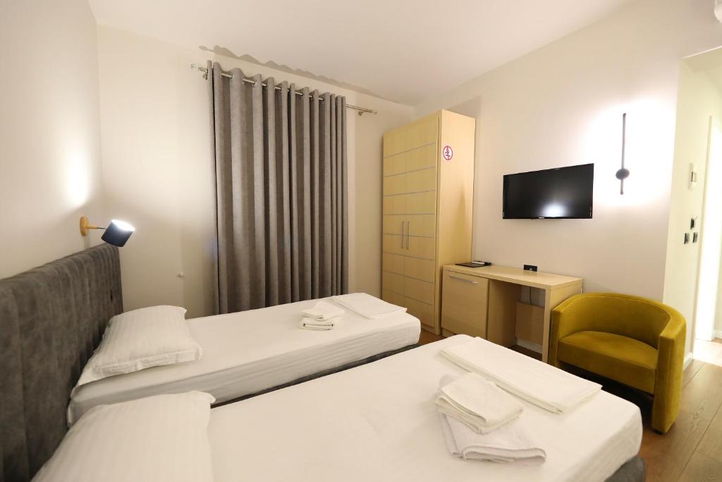 Postel nebo postele na pokoji v ubytování HOTEL LIBERTAS