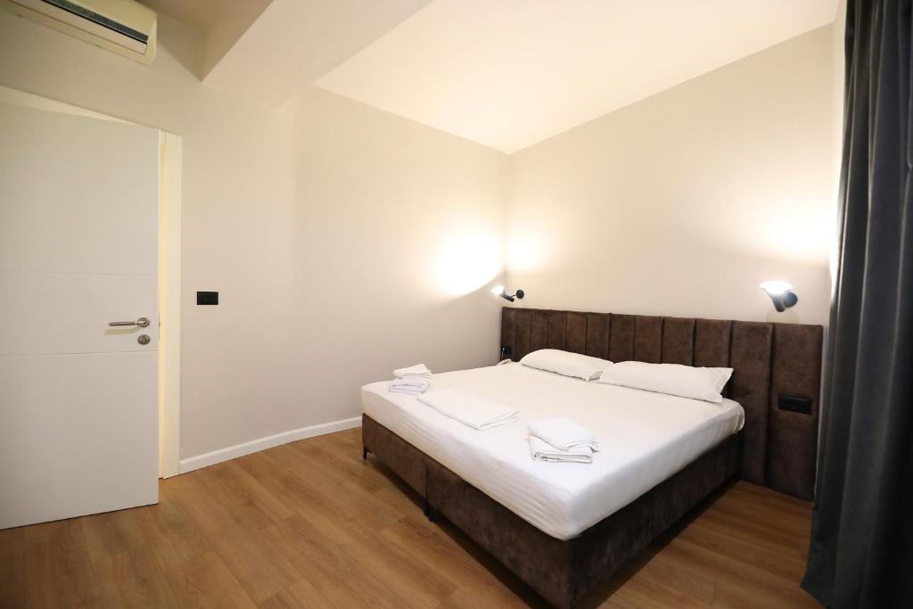 Postel nebo postele na pokoji v ubytování HOTEL LIBERTAS