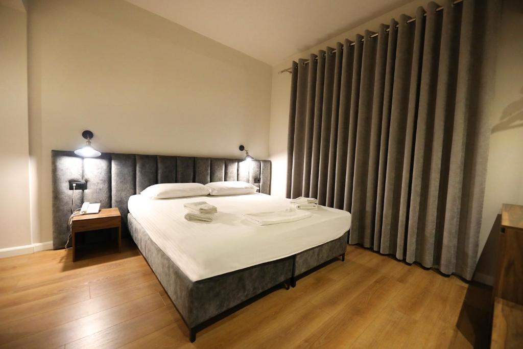 Postel nebo postele na pokoji v ubytování HOTEL LIBERTAS