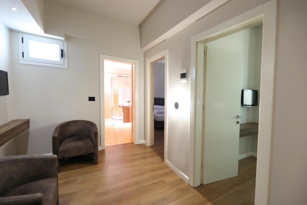TV a/nebo společenská místnost v ubytování HOTEL LIBERTAS