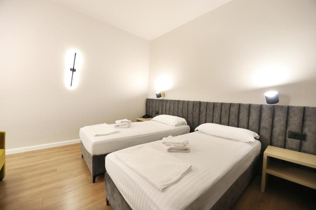 Postel nebo postele na pokoji v ubytování HOTEL LIBERTAS