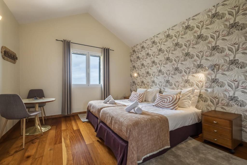 Postel nebo postele na pokoji v ubytování Casas do Salao by Homie