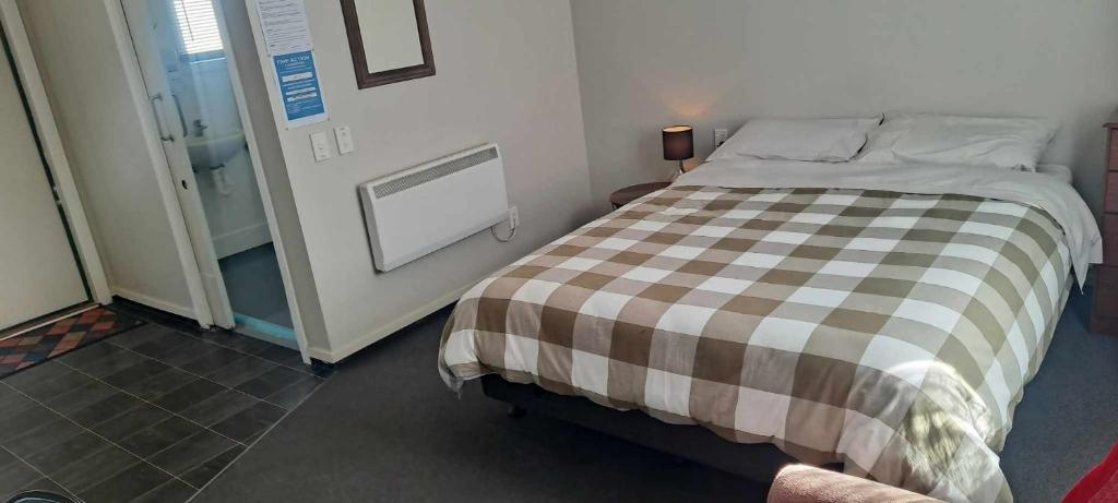 Postel nebo postele na pokoji v ubytování Tō Tātou Kainga