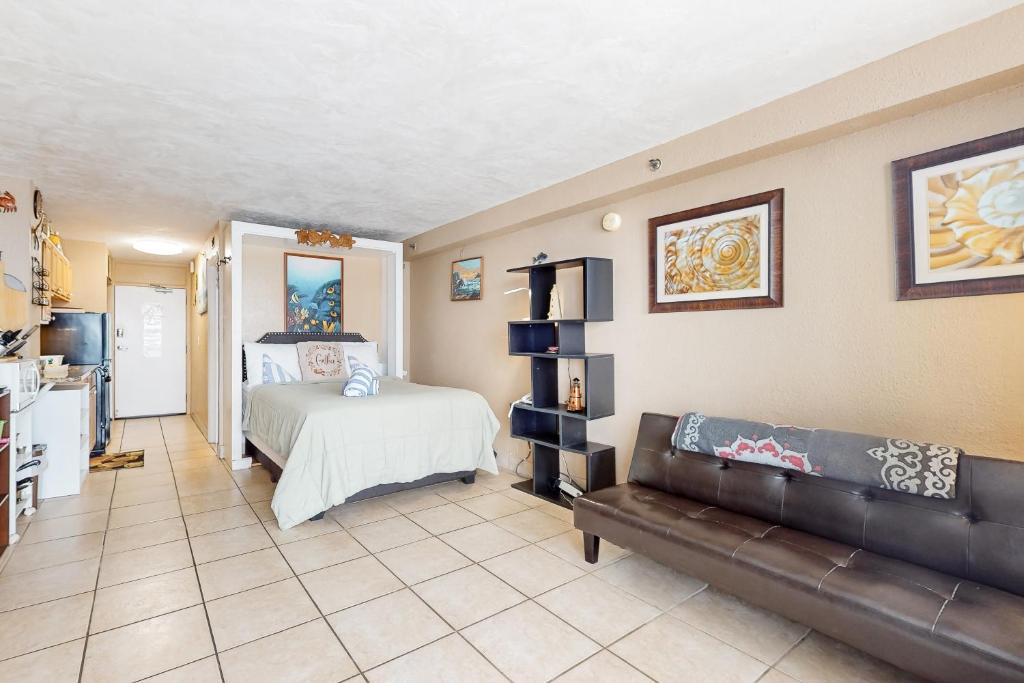 a living room with a bed and a couch at Harbour Beach Resort Unit 808 in Daytona Beach