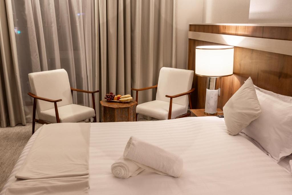 Postel nebo postele na pokoji v ubytování Wassad Hotel Makkah فندق وسد مكة