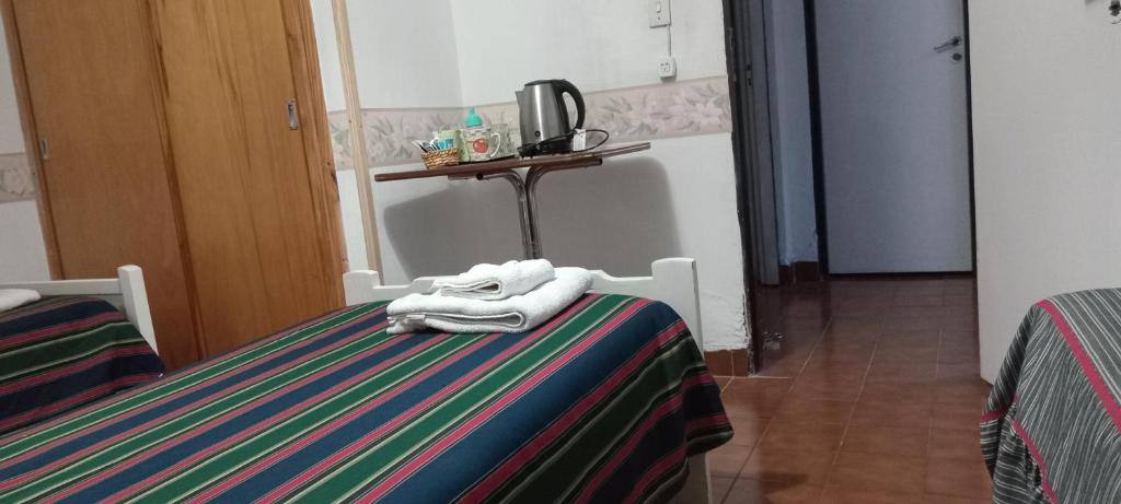 Postel nebo postele na pokoji v ubytování Residencial Sissus