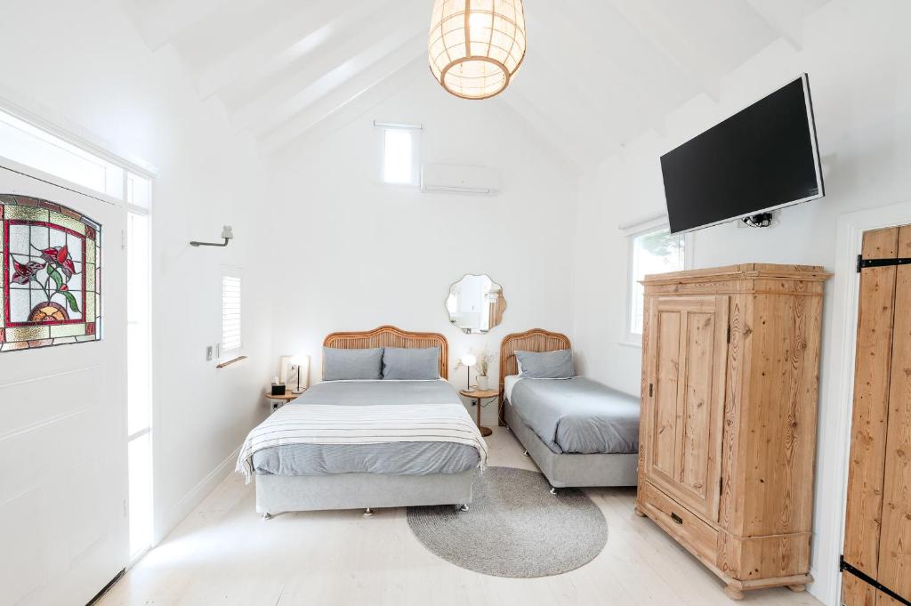 Postel nebo postele na pokoji v ubytování Beach Huts Middleton