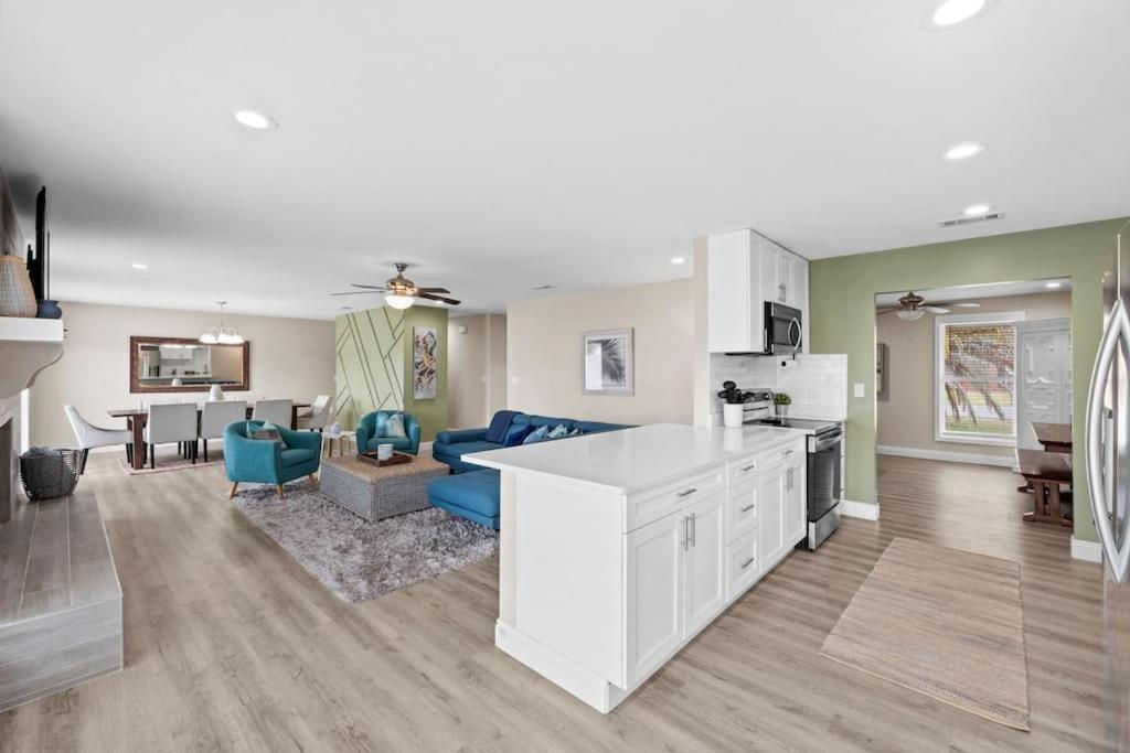 a kitchen and living room with a couch and a table at The Heather Marie - Stylish and Modern Rambler in Panama City