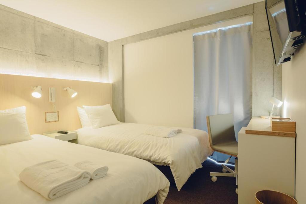 Postel nebo postele na pokoji v ubytování DOMO Hotel