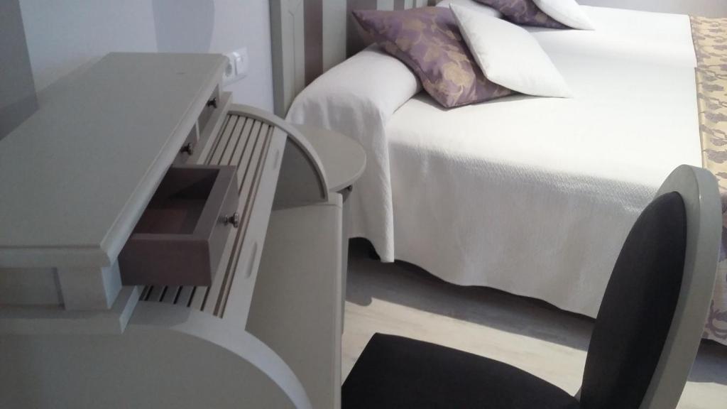 Cama o camas de una habitación en Hotel Valle de Cabezón