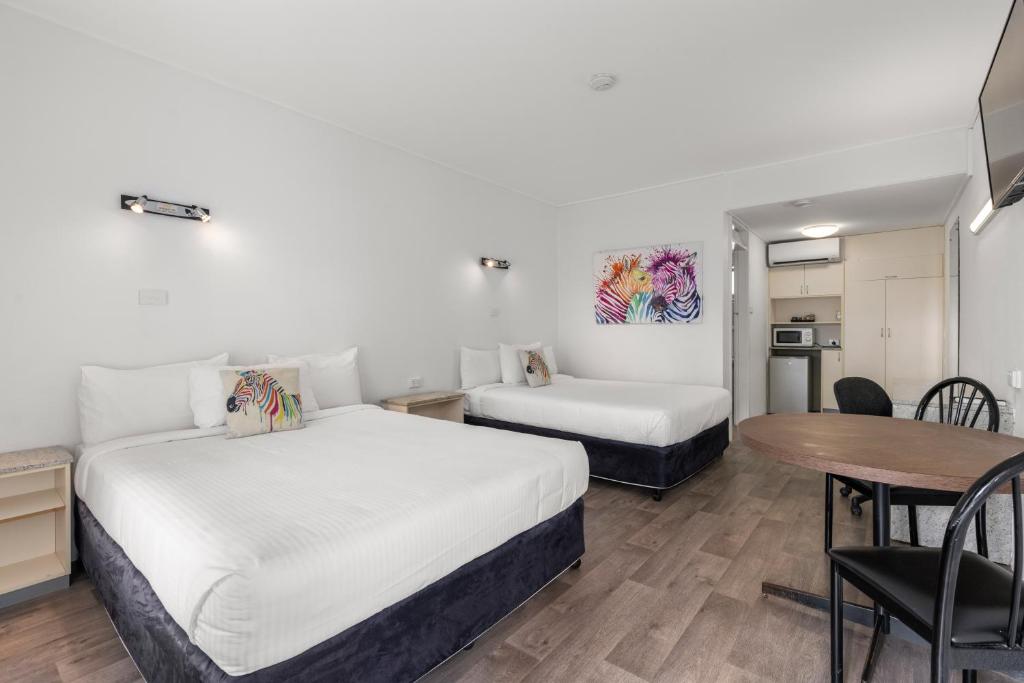 Postel nebo postele na pokoji v ubytování Zebra Motel