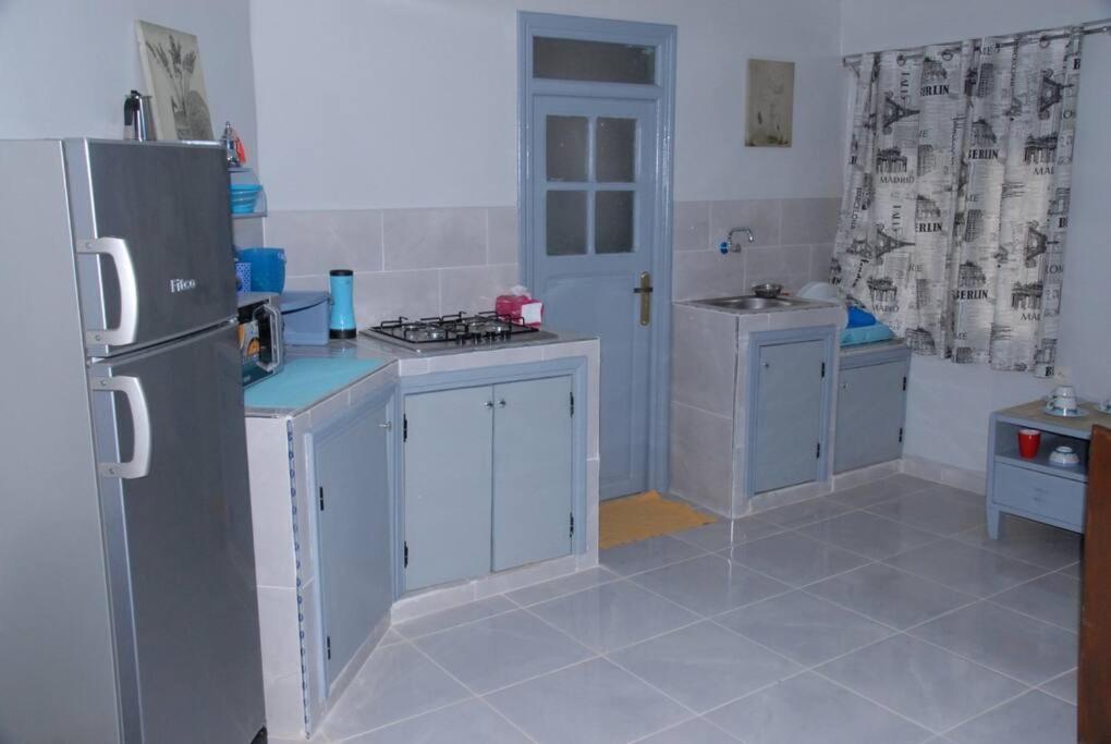 Kuchyň nebo kuchyňský kout v ubytování Élégant Studio