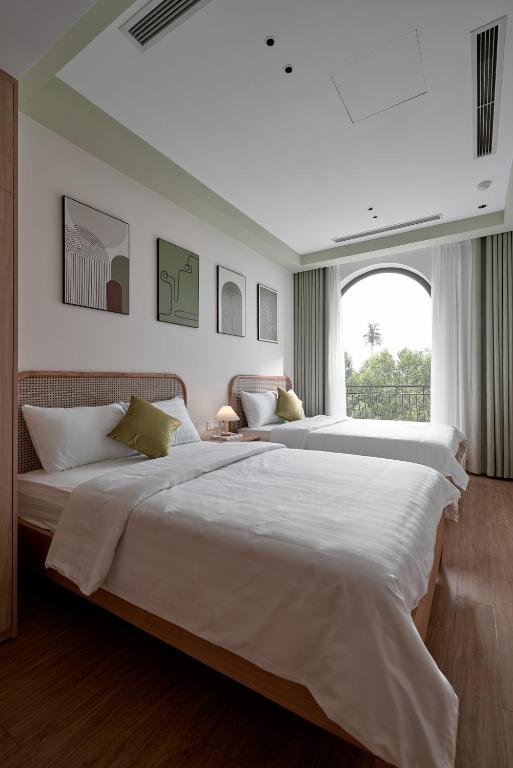 Postel nebo postele na pokoji v ubytování Hotel Ocean Homes