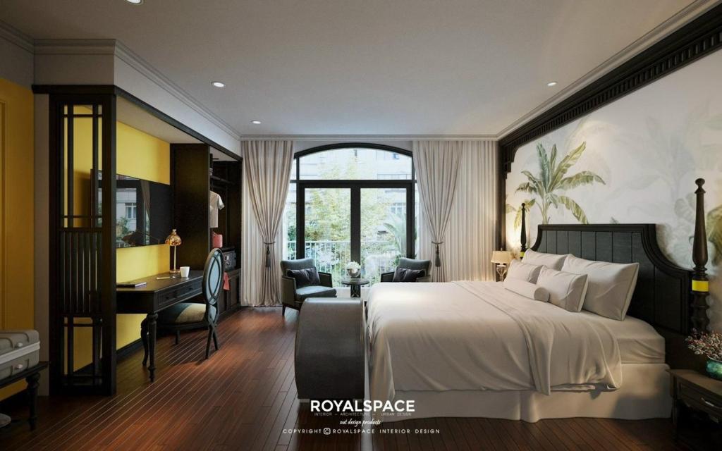 a hotel room with a bed and a desk and a desk at Grand Hotel HN- by BAY LUXURY in Hanoi