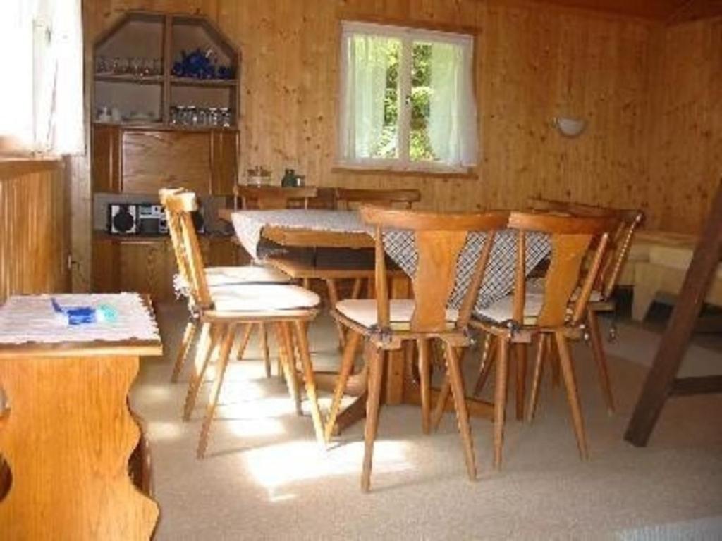 a kitchen with a table and chairs in a room at Ferienhaus für 4 Personen ca 42 qm in Hohenweiler, Vorarlberg Bodensee in Hohenweiler