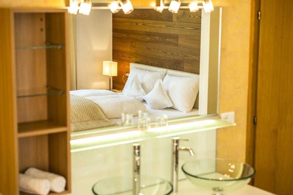 Postel nebo postele na pokoji v ubytování Hotel Pension Verdorfer