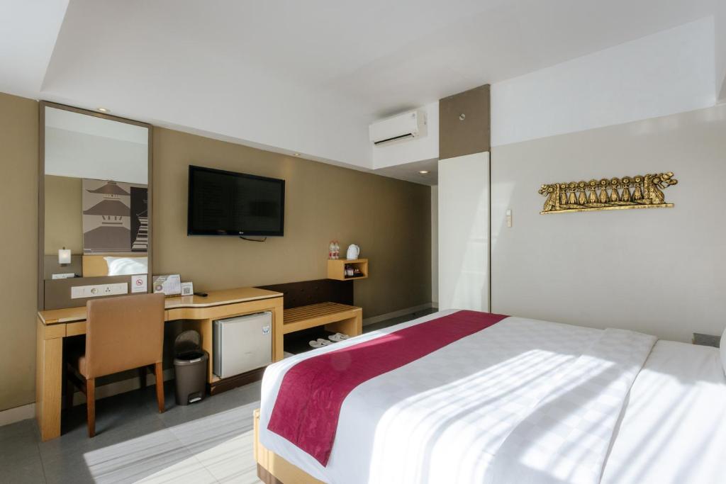 Postel nebo postele na pokoji v ubytování Horison Ultima Seminyak Bali - CHSE Certified