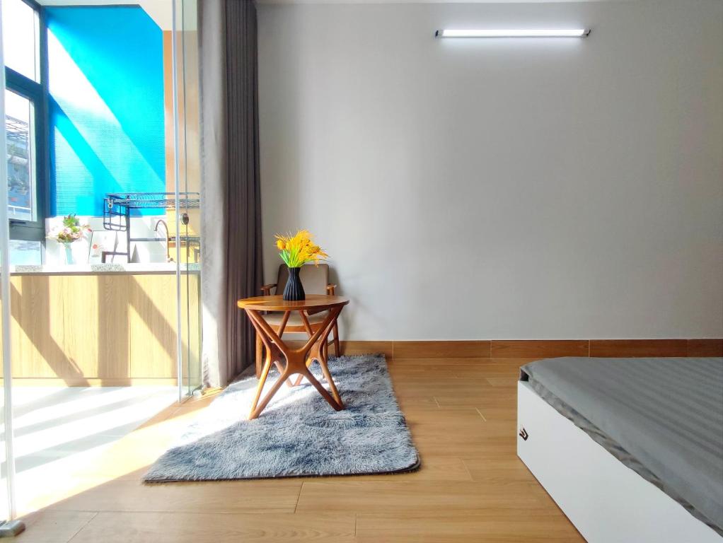 a bedroom with a table with a plant on it at Yên House 09 in Ho Chi Minh City