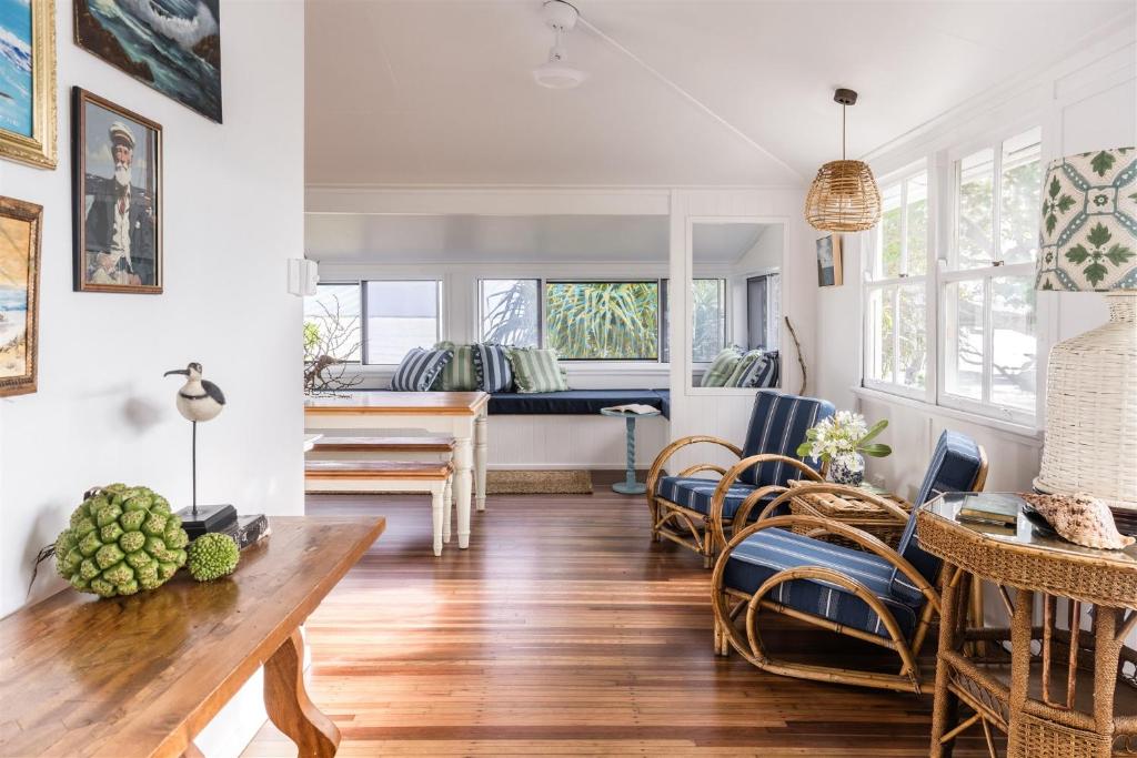 a living room with a table and a couch at Seaspray Yeppoon in Yeppoon