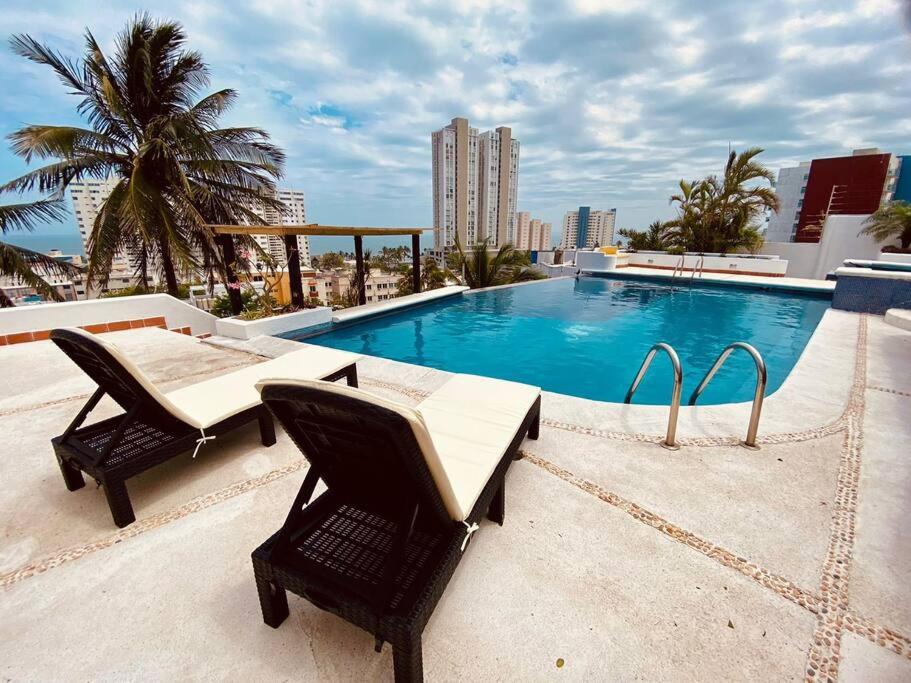 Bazén v ubytování Moderna casa de 3 dormitorios con cama King size y vistas al horizonte de la piscina nebo v jeho okolí