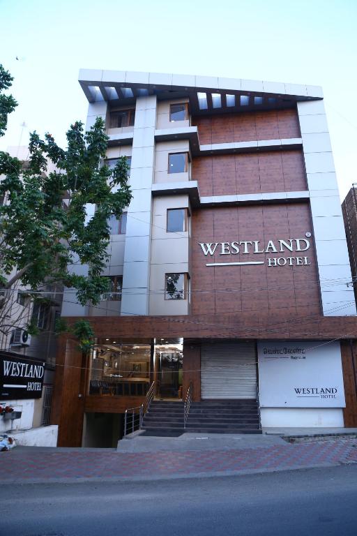 a building with a sign for the westlands hotel at WESTLAND HOTEL- ERODE in Erode
