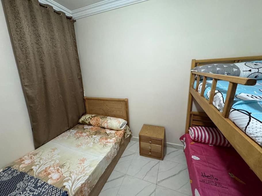 Postel nebo postele na pokoji v ubytování four season matrouh tawer برج مطروح فورسيزون