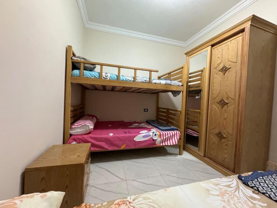 Postel nebo postele na pokoji v ubytování four season matrouh tawer برج مطروح فورسيزون