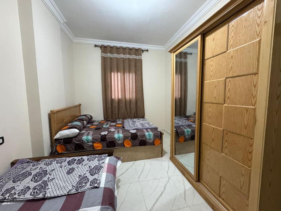 Postel nebo postele na pokoji v ubytování four season matrouh tawer برج مطروح فورسيزون