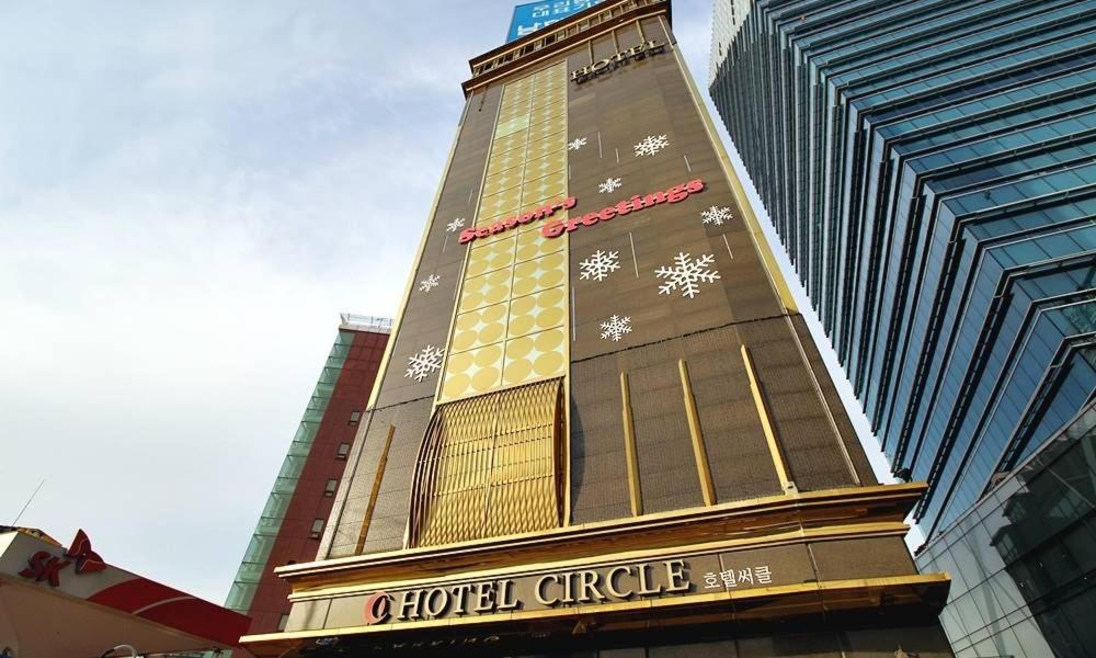 a building with a hotel circle on the side of it at Hapjeong Circle Hotel in Seoul