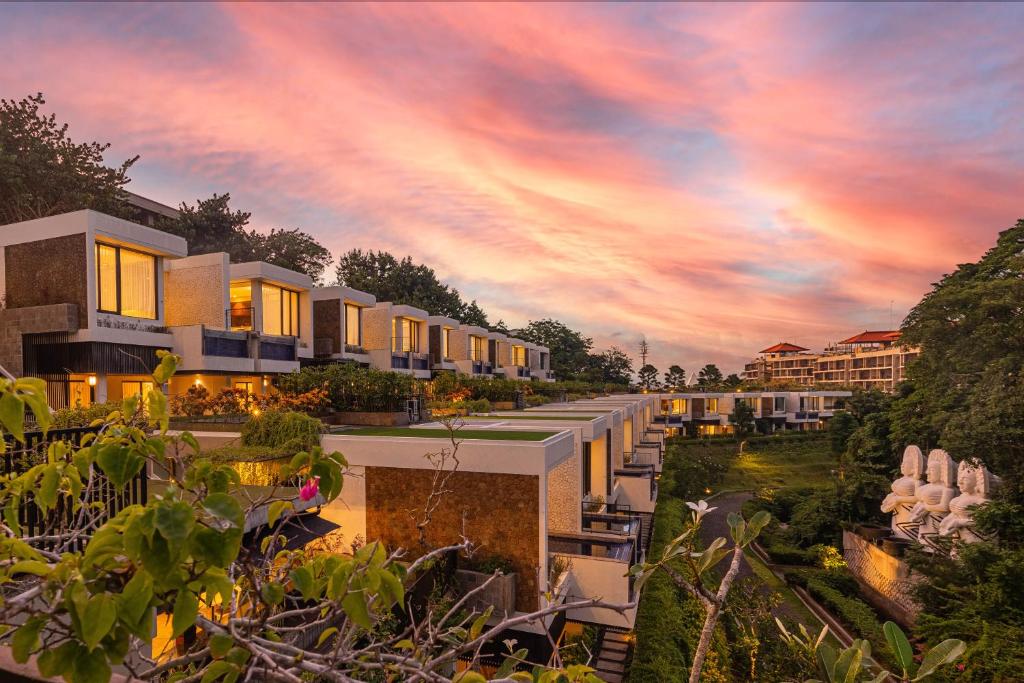 a rendering of the exterior of a resort at sunset at The Sterling Villas in Uluwatu