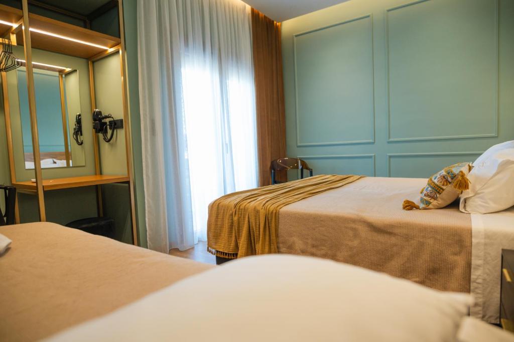 Posteľ alebo postele v izbe v ubytovaní Aggelos Hotel