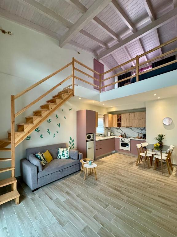 a living room with a couch and a loft at Apidalos Apartments in Corfu
