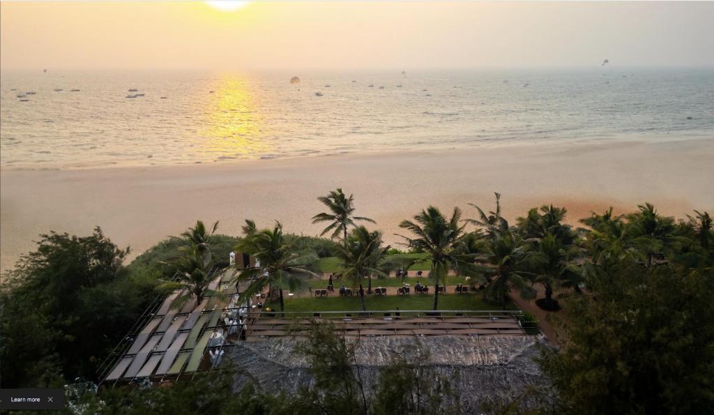 a view of the beach from the balcony of a resort at Chalston Beach Resort in Calangute