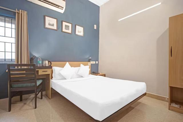 Postel nebo postele na pokoji v ubytování Hotel Sadha Siva