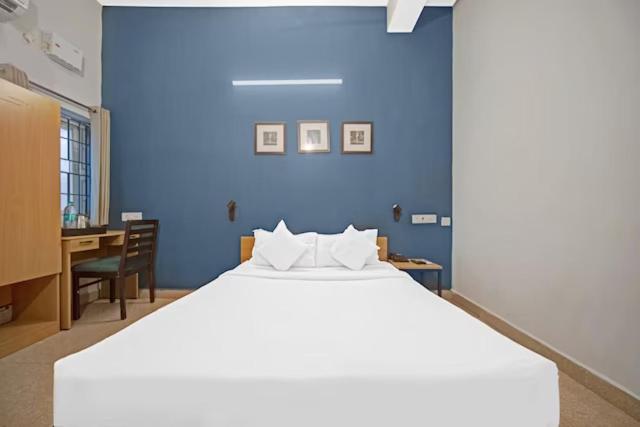 Postel nebo postele na pokoji v ubytování Hotel Sadha Siva