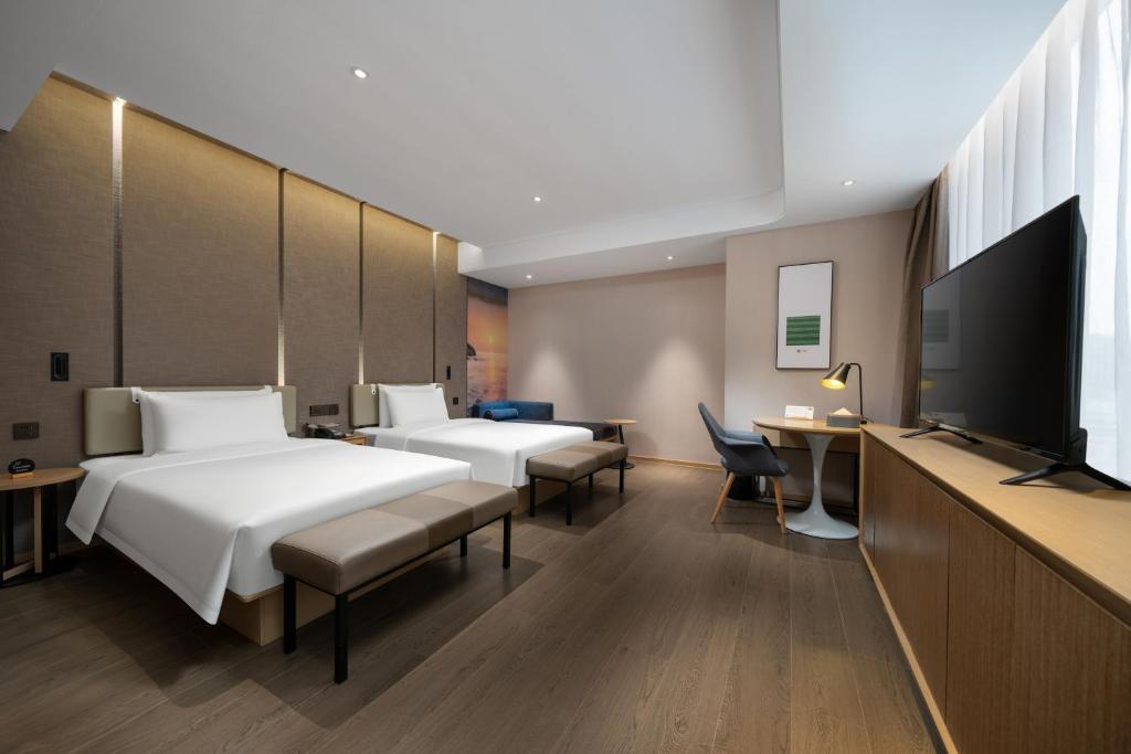TV a/nebo společenská místnost v ubytování Atour S Hotel Shenzhen Longgang Zhonghaixing