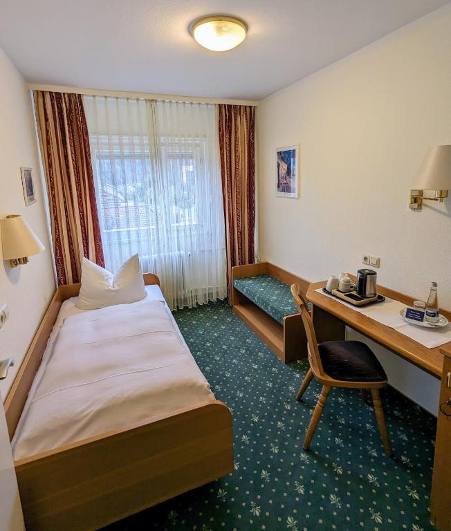 Postel nebo postele na pokoji v ubytování Hotel Fidelitas