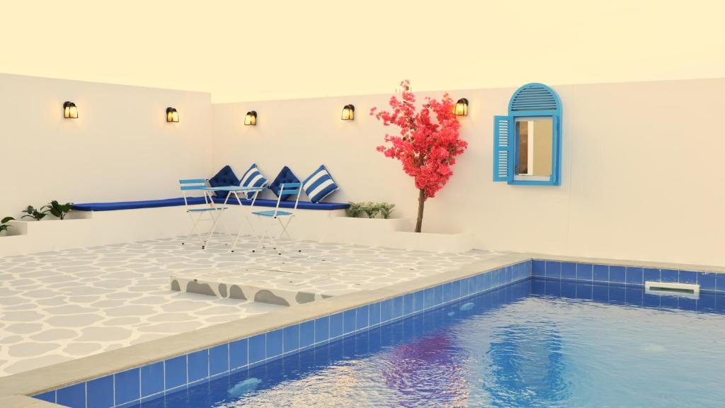 Bazén v ubytování Palms Residence Inn دار النخيل nebo v jeho okolí
