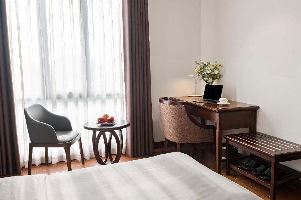 Postel nebo postele na pokoji v ubytování 22Land Residence Hotel & Spa Hanoi