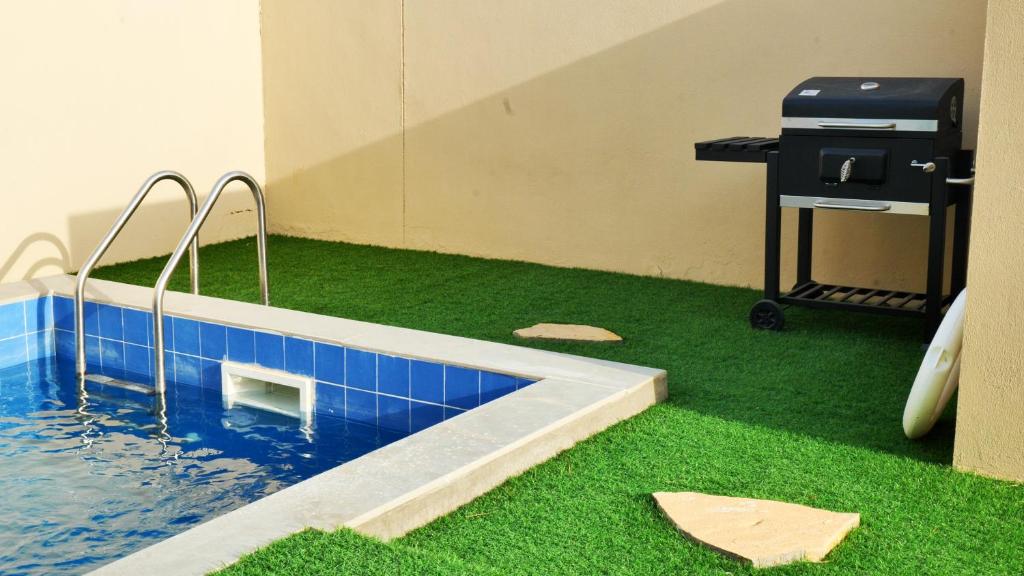 Bazén v ubytování Palms Residence Inn دار النخيل nebo v jeho okolí