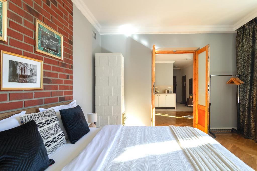 Posteľ alebo postele v izbe v ubytovaní Smile Apartments Center Kraków Old Town