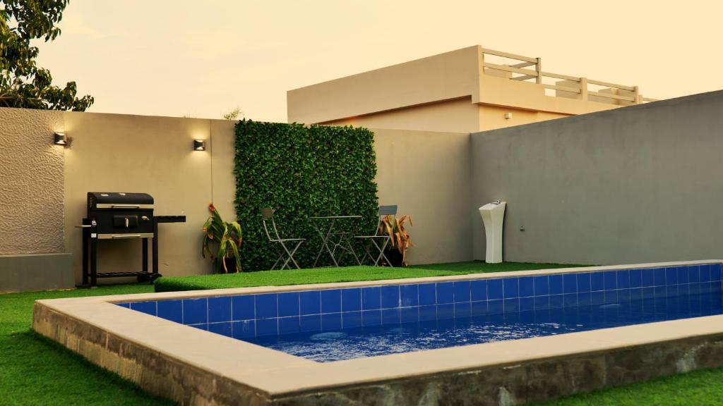 Bazén v ubytování Palms Residence Inn دار النخيل nebo v jeho okolí