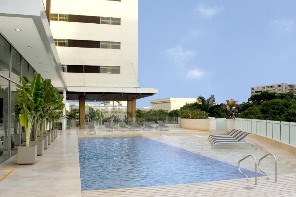 a swimming pool on the roof of a building at Estelar Alto Prado in Barranquilla