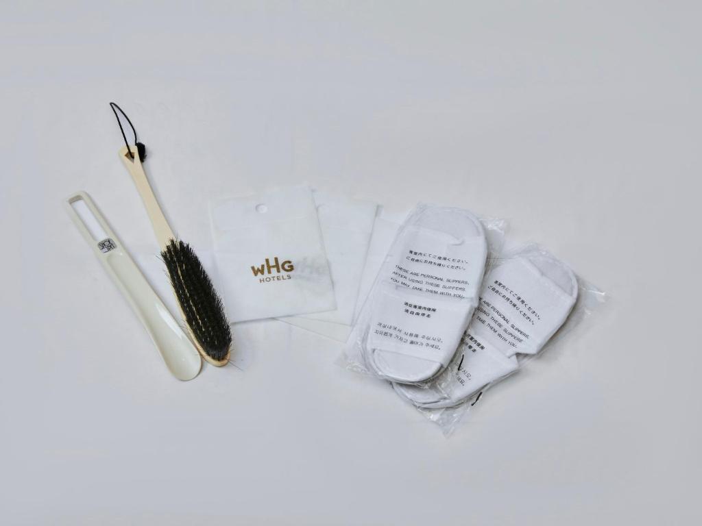 a pile of makeup items including a wand and a brush at Kansai Airport Washington Hotel in Izumi-Sano