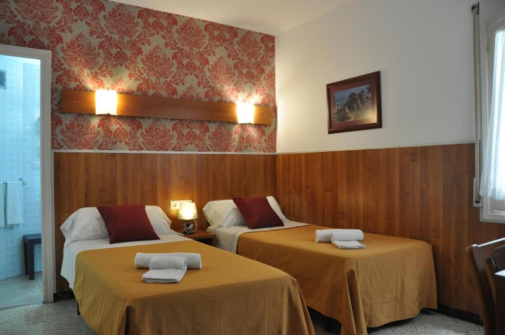 Postel nebo postele na pokoji v ubytování Hostal - Pensión El Amigo