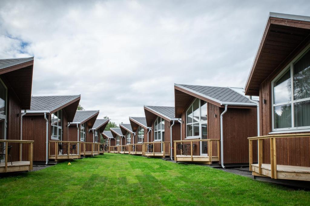 a row of houses with grass in front of them at Tromsø Lodge & Camping in Tromsø