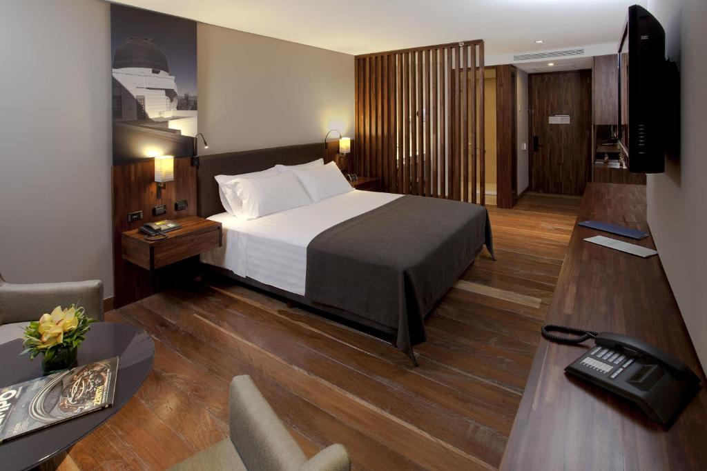 Ein Bett oder Betten in einem Zimmer der Unterkunft Hotel Estelar Parque de la 93